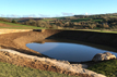 Large ponds with feature stone-work South Devon | Wagland - land & waterscape